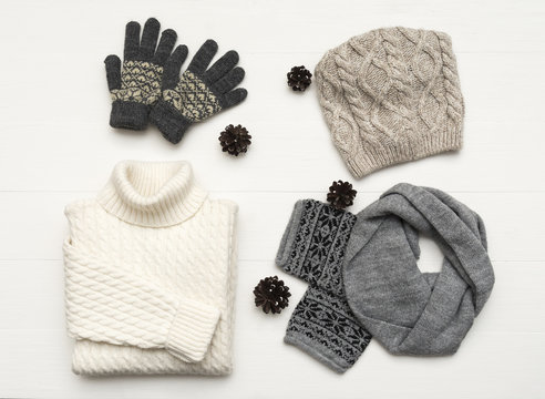 Beauty clothes arrangement with hat, mittens, sweater, scarf. flat lay, top view