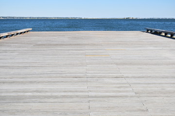 low angle wooden pier with distance burred