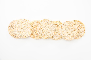 Round corn cakes/ crackers, on white background.