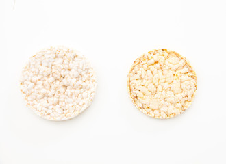 Round rice and corn cakes/ crackers, on white background.