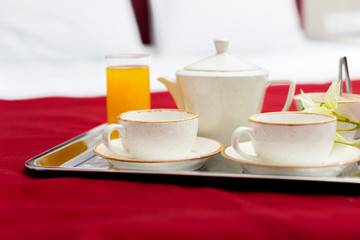 Breakfast in bed in hotel room