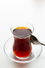 Turkish tea in traditional glass isolated on white background