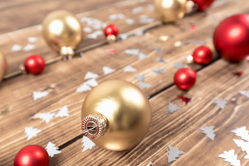 christmas balls red and gold wooden background
