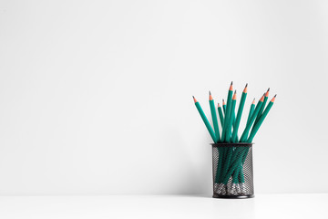 Green pencils in a holder,school supplies