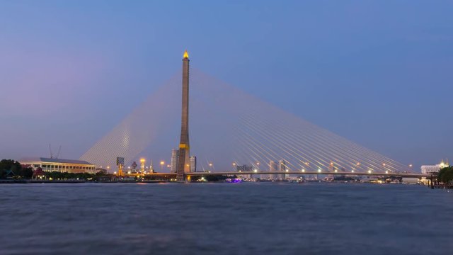 Time lapse day to night of Big Suspension bridge with lighting in night time / Rama 8 bridge in night time