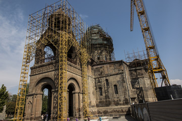 Naklejka premium Repair of the tower of the oldest cathedral in the world, Etchmiadzin cathedral in Armenia