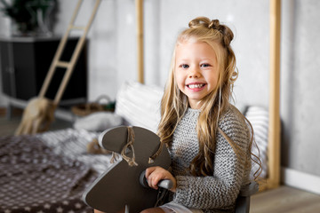 Fototapeta na wymiar Portrait of a smiling little girl in the studio
