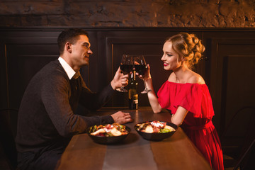 Couple raised glasses, anniversary celebration