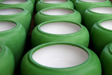 Large empty pots green abstract background.