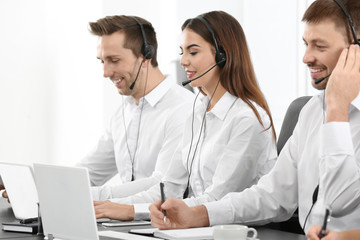 Fototapeta premium Consulting managers with headsets in office