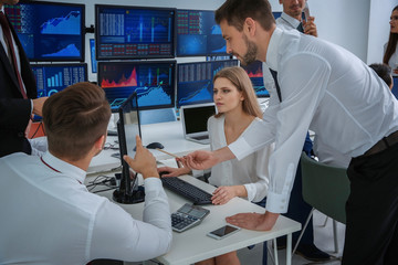 Stock traders working in office