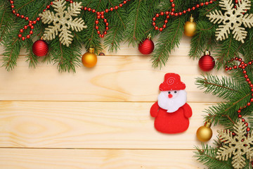 Christmas background. Top view with copy space. fir tree with cone on light wooden background