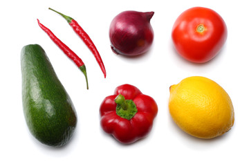 healthy food. mix of avocado, lemon, tomato, red onion, garlic, sweet bell pepper and rucola leaves isolated on white background top view
