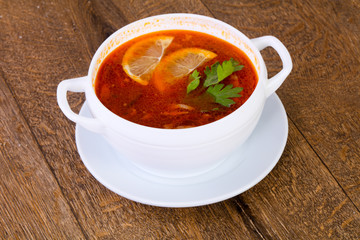 Solyanka soup with lemon