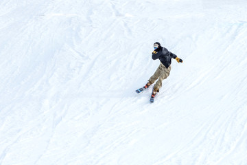 Naklejka na ściany i meble People are having fun in downhill skiing and snowboarding
