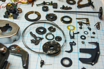 parts old retro film SLR camera on graph paper