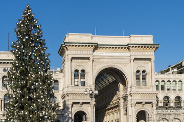 Fototapeta na wymiar Christmas tree and Galleria Vittorio Emanuele in Duomo square, Milan, Italy.