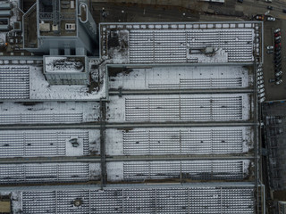 Aerial view of snow covered roof of industry building 