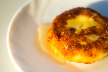 fried cheesecake drizzled with fresh honey