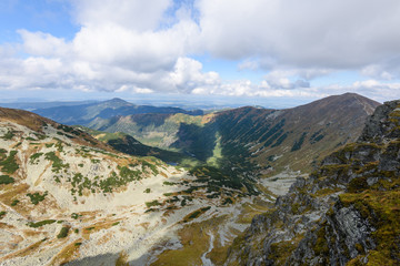 mountain tops in  autumn covered in mist or clouds