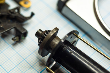 parts old retro film SLR camera on graph paper