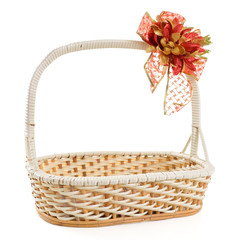 Fototapeta na wymiar Empty wicker basket with bow isolated on white background