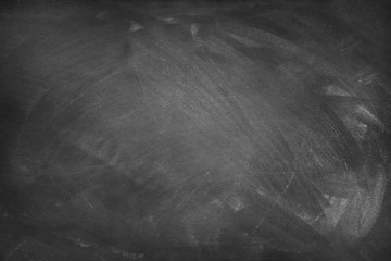 Chalk rubbed out on black board or chalkboard background