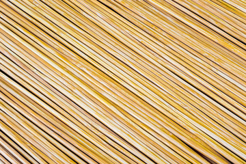 Wooden yellow bamboo mat texture abstract background.