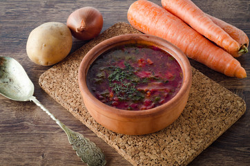 Bowl of traditional soup Borscht on table