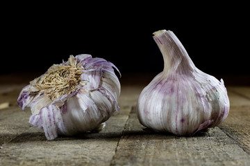 Tasty Italian garlic in an old kitchen on a wooden table