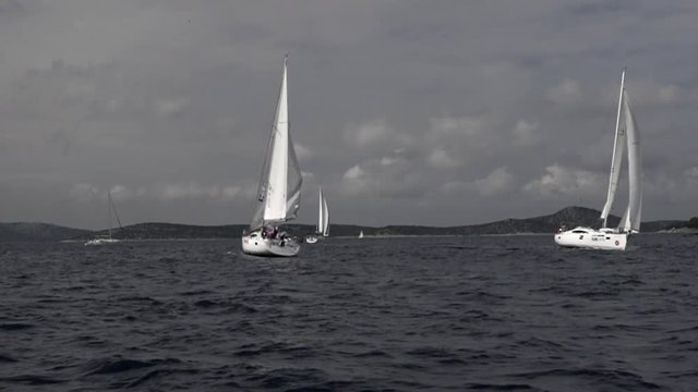 Sailing yacht in ocean slow motion. Black and white background. Transportation for water sports.