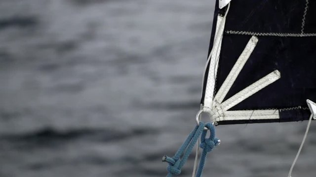 Sailing yacht in ocean slow motion. Black and white background. Transportation for water sports.