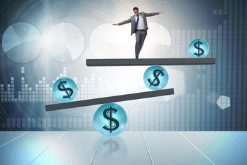 Businessman balancing in financial dollar concept