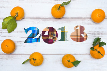 The inscription two thousand eighteen and tangerines