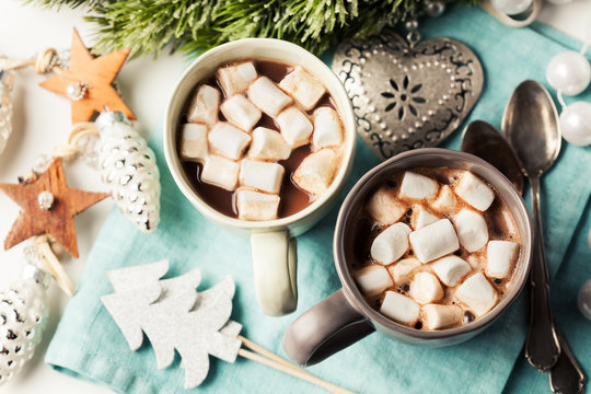 Hot chocolates with marshmallows in Christmas setup