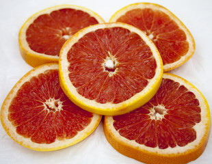 Grapefruit slices background texture.