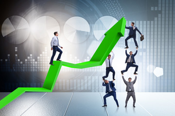Fototapeta premium Businessman supporting growtn in economy on chart graph