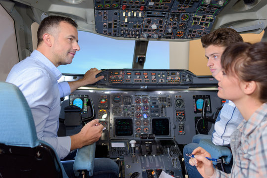 People in aircraft cockpit