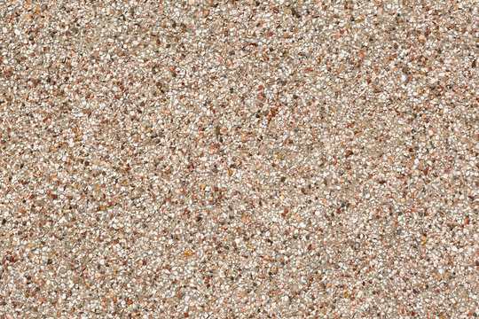 Close up image of a pebble-dashed wall