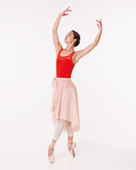 Beautiful ballerina posing in a white studio. Ballerina on a white background. Ballerina in red tights.