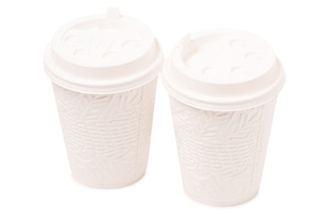 Two white cardboard cups of coffee snowning  winter Christmas with snowflakes