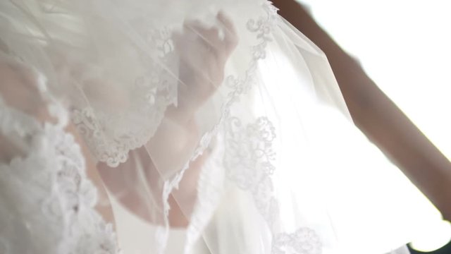 Wedding veil on bed
