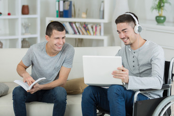 male friends giggling on what they saw on the internet