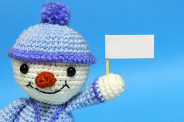 snowman with posters on a blue background