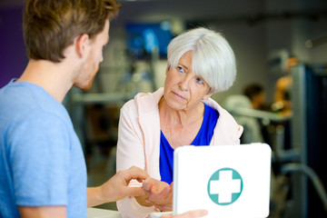 young man bandage his grandmother