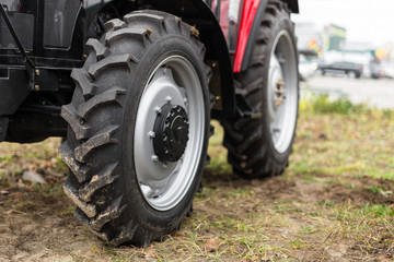 Equipment for agriculture, machines  presented to an agricultural exhibition.  Tractors outdoors