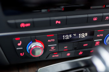 Close-up  of modern luxury car climate control panel