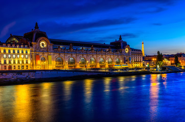 Night view of Orsay Museum (Musee d'Orsay) in Paris, France - obrazy, fototapety, plakaty