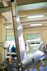 Airplane fin, workshop. Steel with rivets, aircraft body.