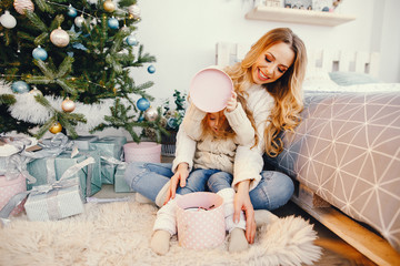 mommy and daughter opening gifts